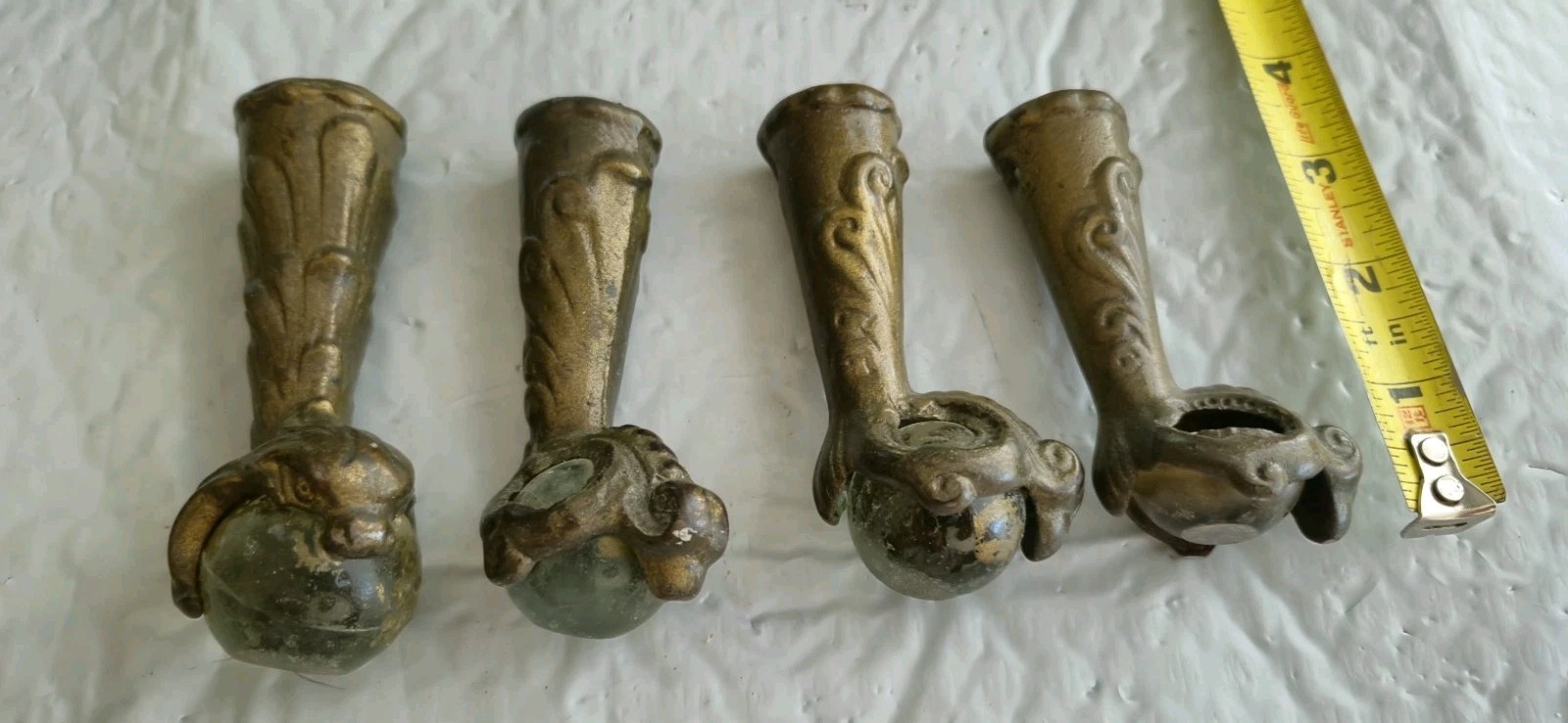 Antique 4 Cast Iron Glass Ball and Claw Feet. 1 Glass Broken. 1 Seems Larger.