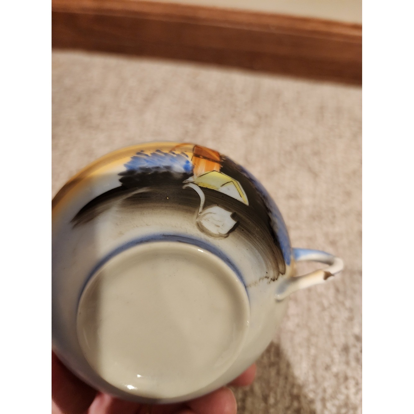 Hand-Painted Ceramic Teacup with Blue and Yellow Landscape Motif